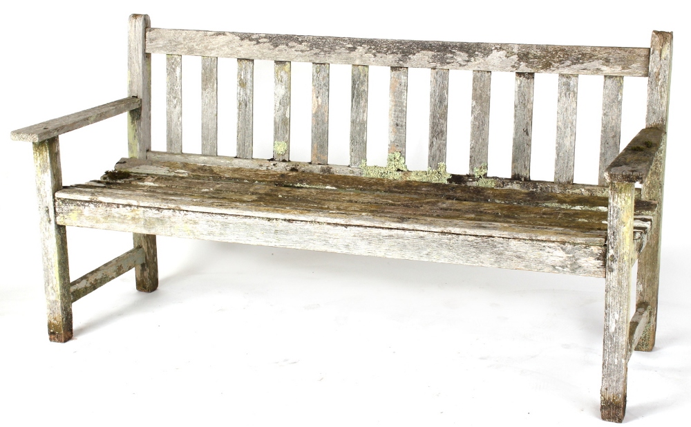 Property of a deceased estate - a well weathered Burmese teak garden bench, 62ins. (157.5cms.)
