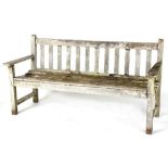 Property of a deceased estate - a well weathered Burmese teak garden bench, 62ins. (157.5cms.)