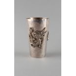 A late 19th / early 20th century Chinese silver beaker decorated in relief with two opposing dragons