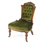 Property of a lady - a Victorian carved walnut & green button upholstered nursing chair with