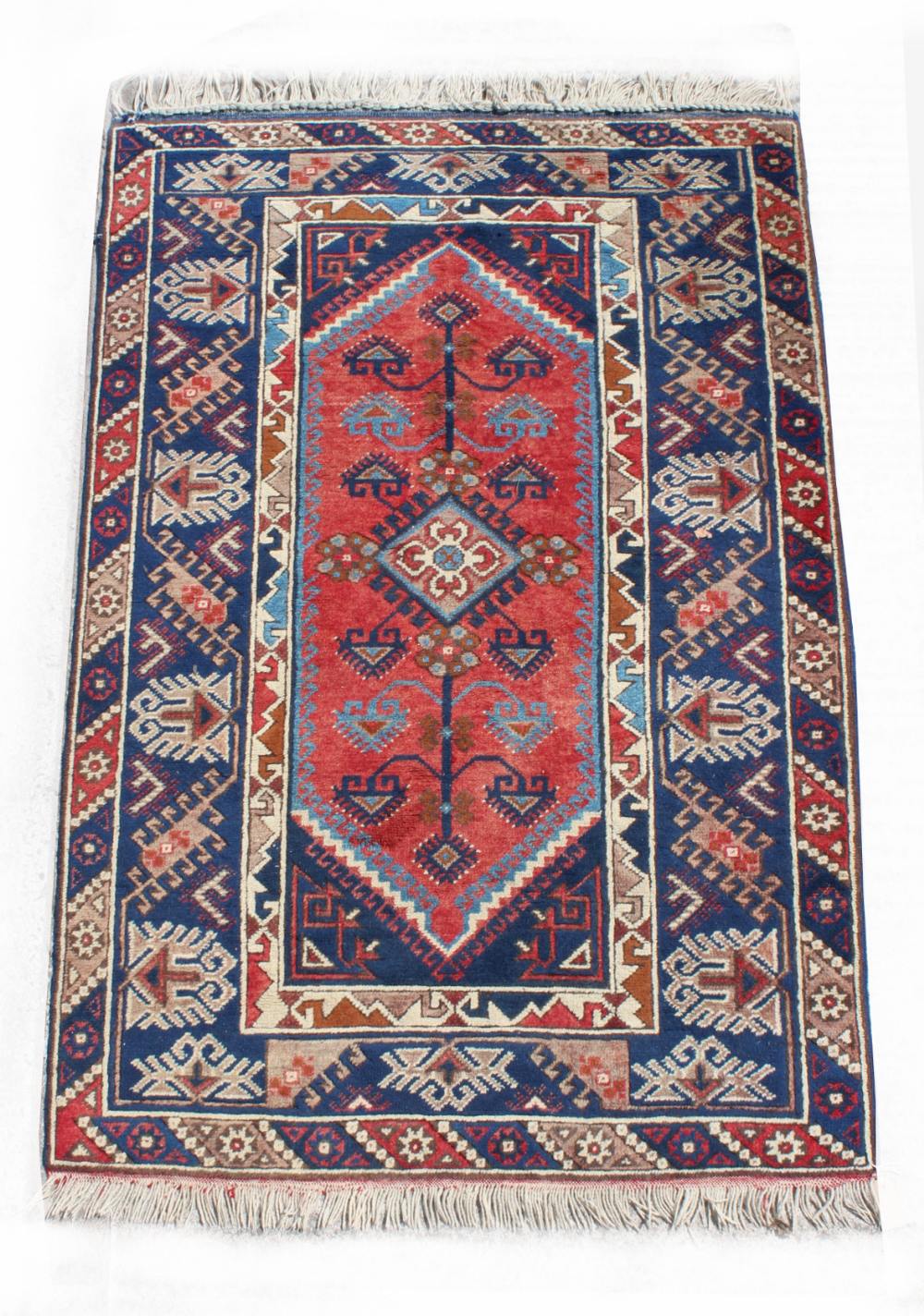 Property of a lady - a Turkish Erevan rug, with navy ground, 71 by 48ins. (180 by 122cms.) (see