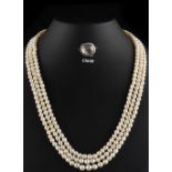 A fine certificated natural saltwater pearl three strand necklace, the three hundred & eleven