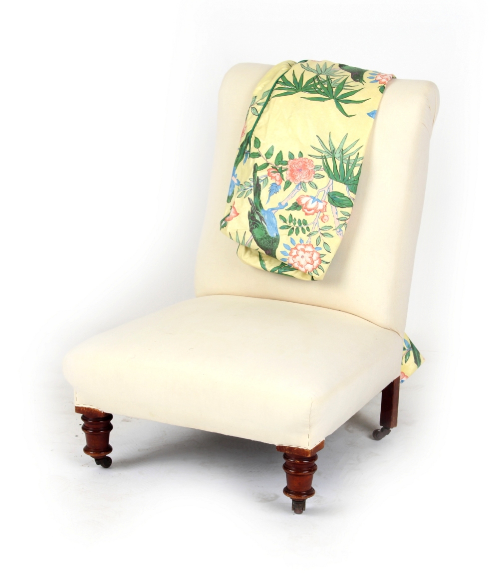 Property of a lady - a Victorian upholstered nursing chair with turned front legs & castors, with