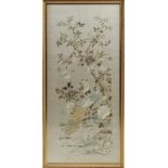 A large Chinese embroidered silk panel depicting birds & butterflies among flowering shrubs, late