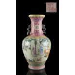 A Chinese famille rose baluster vase, painted with a continuous scene of scholars & boys in a