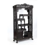 A good Chinese carved hongmu display cabinet, late 19th / early 20th century, fitted with a