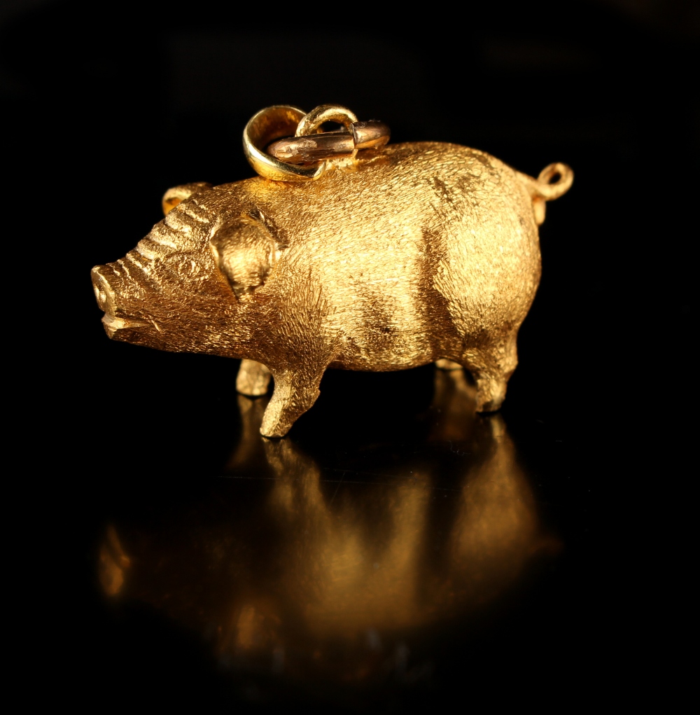 Property of a lady - a Chinese 24ct gold (chuk kam) pendant modelled as a pig, with two associated