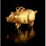 Property of a lady - a Chinese 24ct gold (chuk kam) pendant modelled as a pig, with two associated