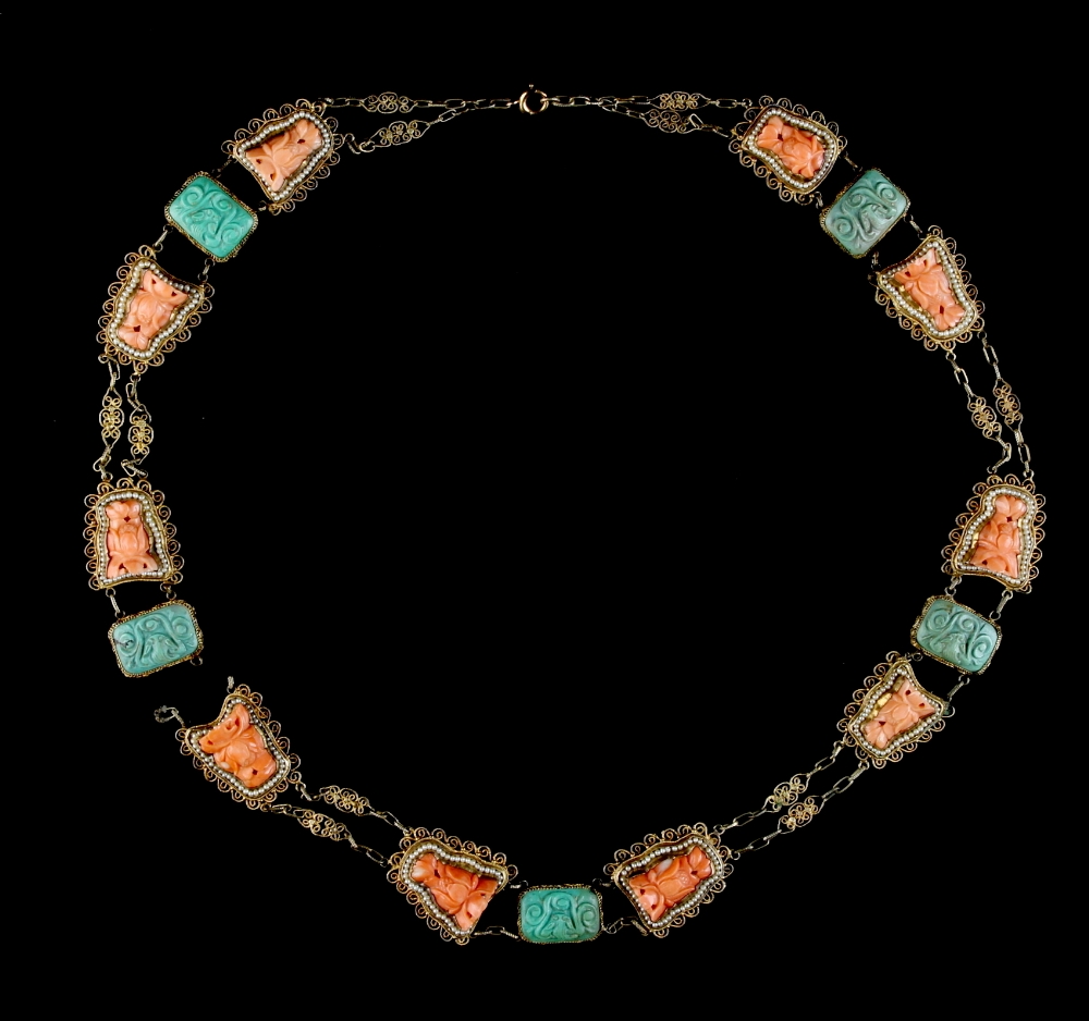 A Chinese filigree gilt metal, carved coral, turquoise & seed pearl panel necklace, late 19th /