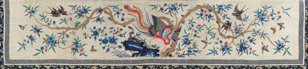 An early 20th century Chinese embroidered silk panel depicting a phoenix, birds & butterflies around