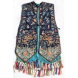 A Chinese navy blue silk sleeveless jacket, late 19th / early 20th century, decorated in gilt thread