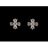 Tiffany & Co. - a pair of platinum diamond flowerhead earrings, with post & butterfly fastenings,