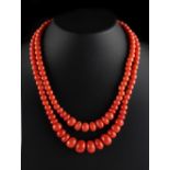 A coral graduated bead two strand necklace, the largest bead approximately 14.1mm, with 18ct