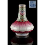 A Chinese famille rose bottle vase of moulded lotus form with lime green ground neck, underglaze