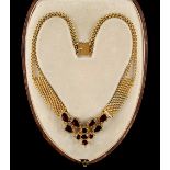 A 14ct yellow gold garnet necklace, with pear drop, oval & round cut garnets, French shell guarantee