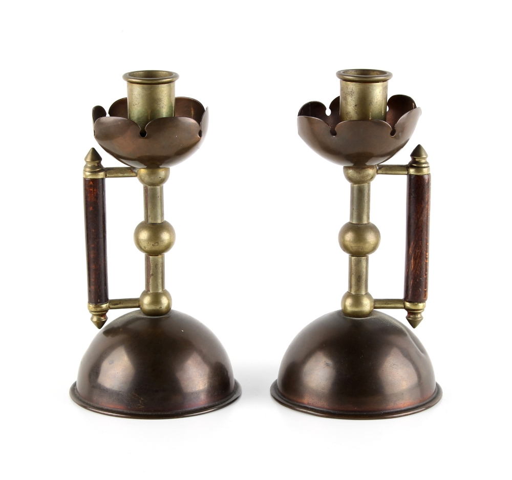 Property of a gentleman - a pair of Arts & Crafts copper & brass candlesticks or chambersticks, in