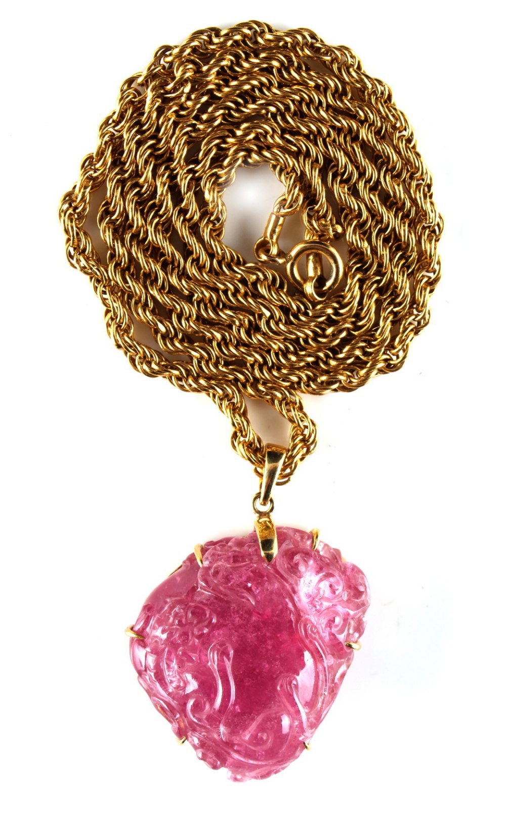 Property of a lady - a large Chinese carved pink tourmaline pendant modelled as two chilong around a