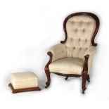 A Victorian walnut & button upholstered spoon-back armchair, with cabriole front legs & castors;