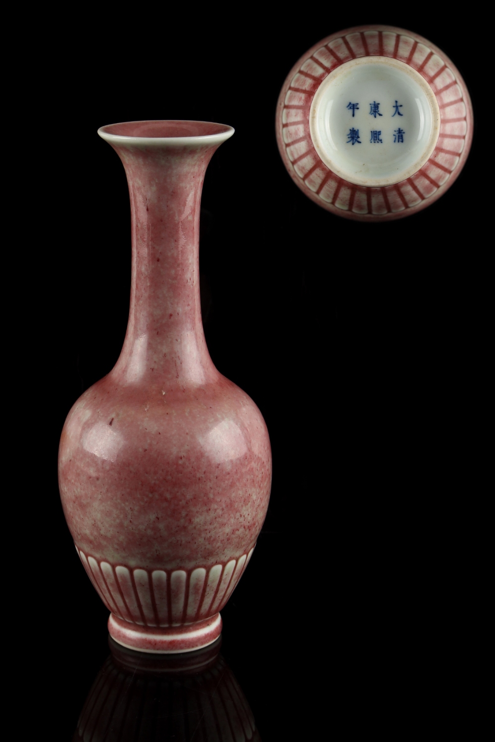 A Chinese peach bloom slender vase, apocryphal Kangxi 6-character mark, 8.05ins. (20.5cms.) high (