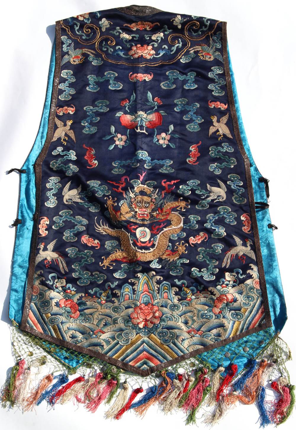 A Chinese navy blue silk sleeveless jacket, late 19th / early 20th century, decorated in gilt thread - Image 2 of 2