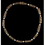 A yellow gold & pearl necklace of feather design, the thirteen untested pearls each approximately