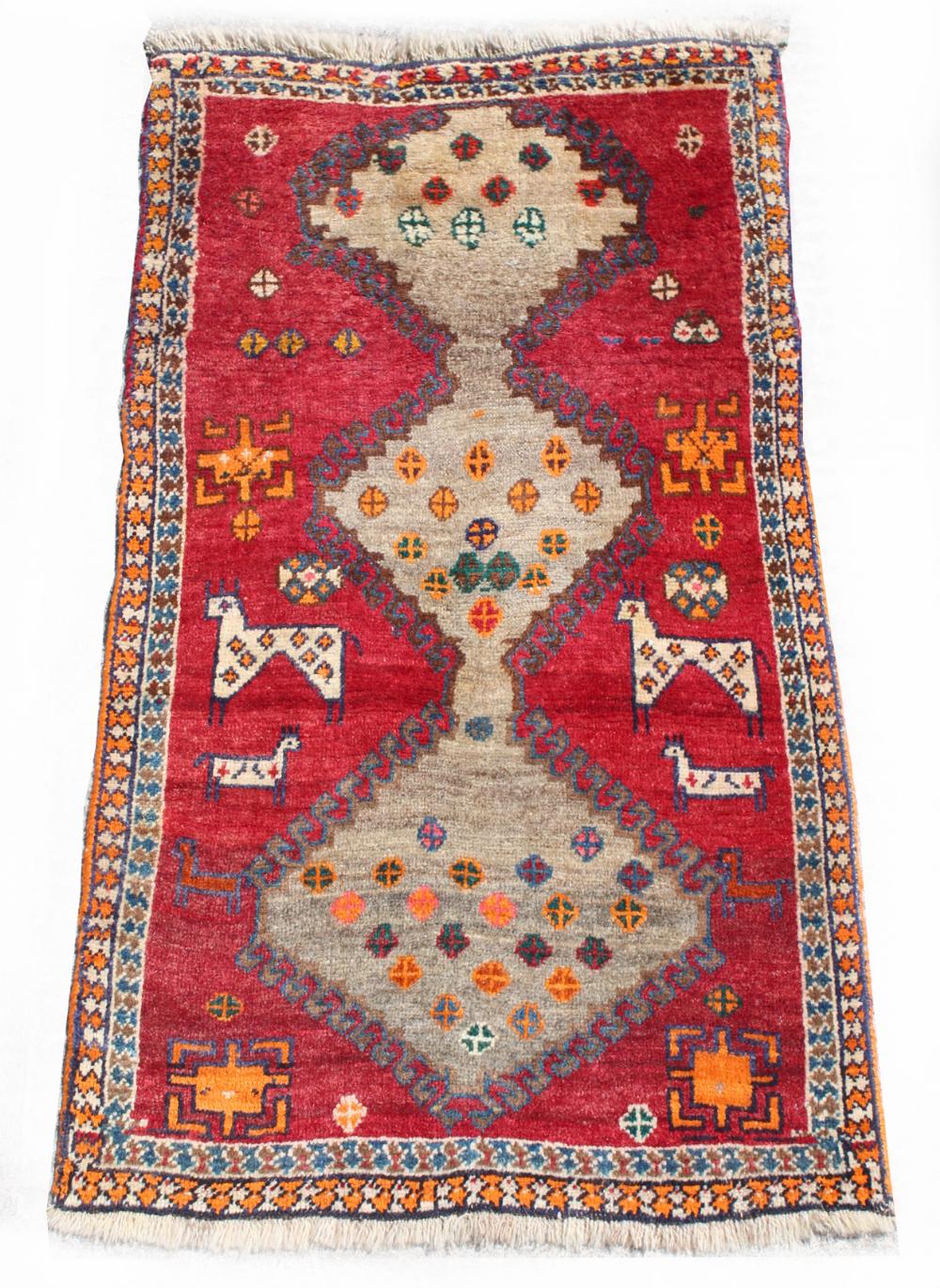 Property of a deceased estate - a Qashgai rug with animal motifs, 56 by 35ins. (142 by 89cms.) (