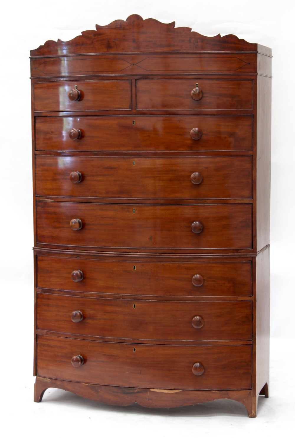 Property of a gentleman - an early 19th century mahogany bow-fronted tallboy or chest-on-chest, with