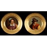 A pair of early 19th century Denuelle Paris porcelain plates painted with portraits of peasants,