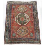 Property of a lady - a Turkish Kazak style rug, with pale red field, 81 by 56ins. (205 by