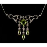 A Belle Epoque style peridot & diamond necklace, the central pentagonal table cut peridot