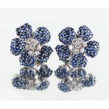 Tiffany & Co. - a pair of good quality 18ct white gold sapphire & diamond flowerhead earrings of