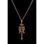 An Edwardian yellow gold sapphire & seed pearl pendant, with four millegrain set round cut sapphires