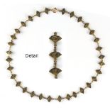 A Japanese bronze necklace with fan shaped links, 20.5ins. (52cms.) long (see illustration).