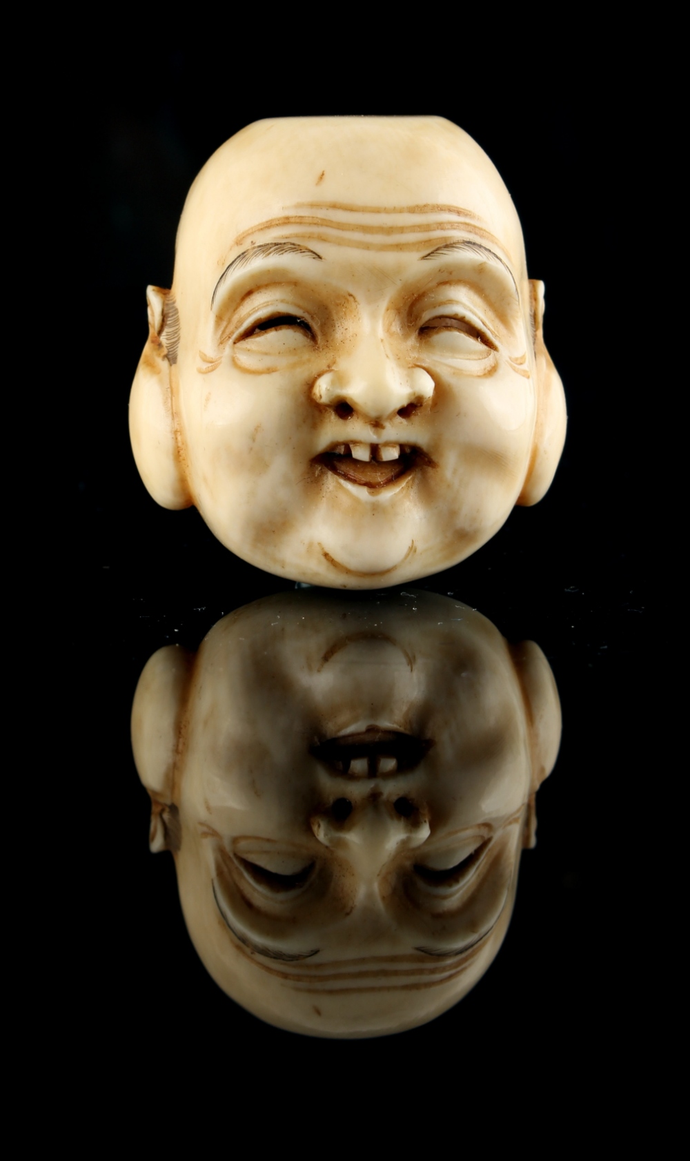The Ronald Hart Collection of Japanese Netsukes - a carved ivory netsuke modelled as a mask of - Image 3 of 6