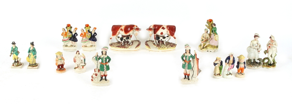 Property of a gentleman - a quantity of Victorian Staffordshire figures including a pair of cow &