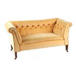 Property of a gentleman - an Edwardian peach coloured button upholstered double drop-end sofa,