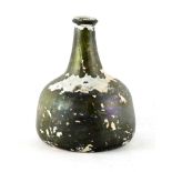 Property of a lady - a late 17th / early 18th century onion shaped wine bottle, with iridescence,
