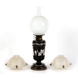 Property of a lady - a late 19th century W.H. Honey black opaque glass oil lamp with white enamel