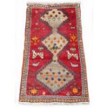 Property of a deceased estate - a Qashgai rug with animal motifs, 56 by 35ins. (142 by 89cms.) (