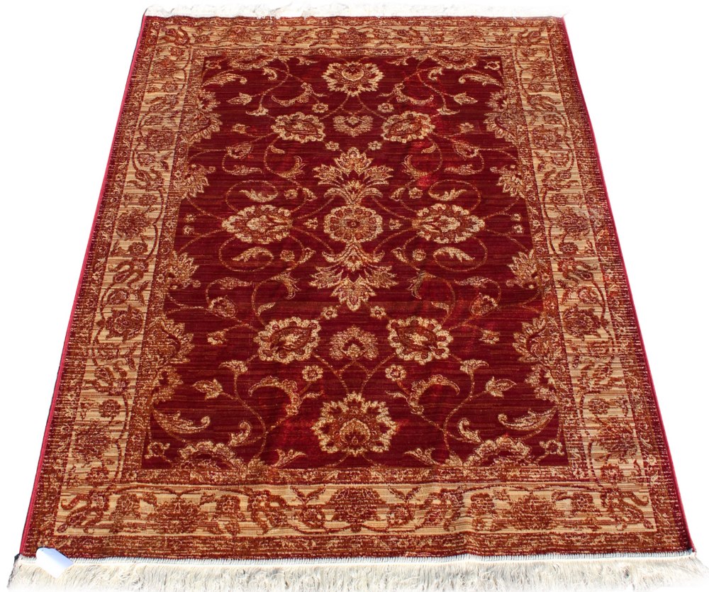 A Zeigler style rug with red ground, 75 by 53ins. (191 by 133cms.) (see illustration).