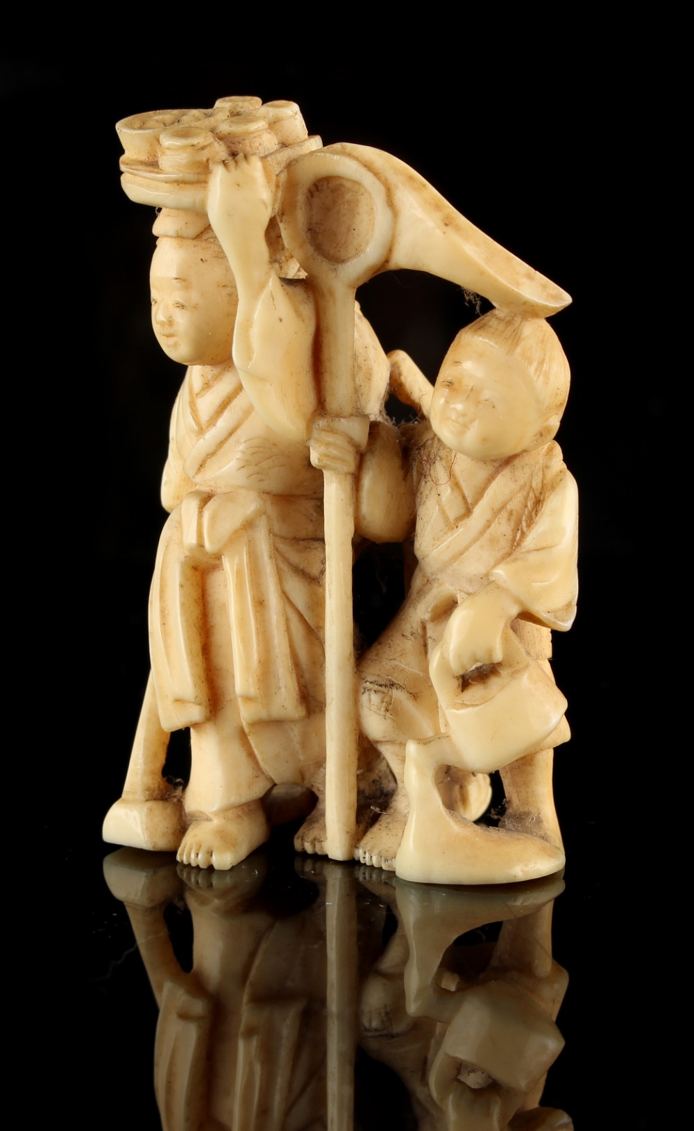 The Ronald Hart Collection of Japanese Netsukes - a carved ivory netsuke modelled as a standing lady - Image 6 of 6