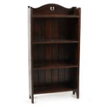 Property of a lady - an early 20th century oak narrow open bookcase, 21.25ins. (54cms.) wide (see