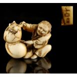 The Ronald Hart Collection of Japanese Netsukes - a carved ivory netsuke modelled as a seated figure