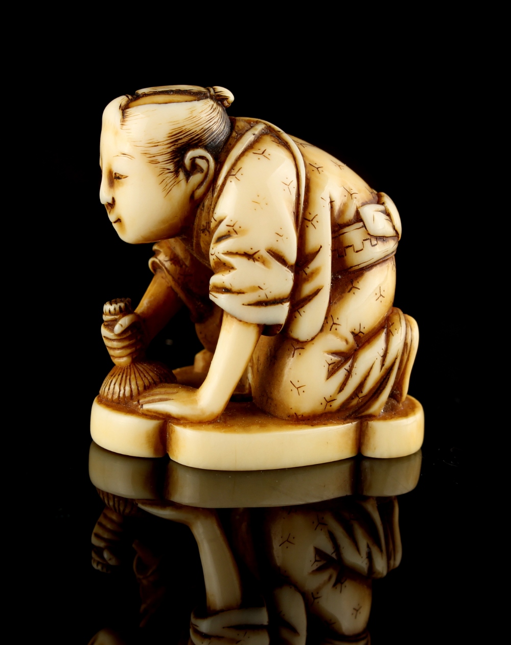 The Ronald Hart Collection of Japanese Netsukes - a carved ivory netsuke modelled as a kneeling - Image 2 of 6