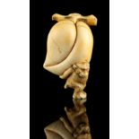 The Ronald Hart Collection of Japanese Netsukes - a carved ivory netsuke modelled as a monkey