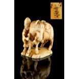 The Ronald Hart Collection of Japanese Netsukes - a carved ivory netsuke modelled as a horse &