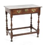 Property of a lady - an oak side table, parts early 18th century, with frieze drawer on turned