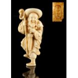 The Ronald Hart Collection of Japanese Netsukes - a carved ivory netsuke modelled as a standing