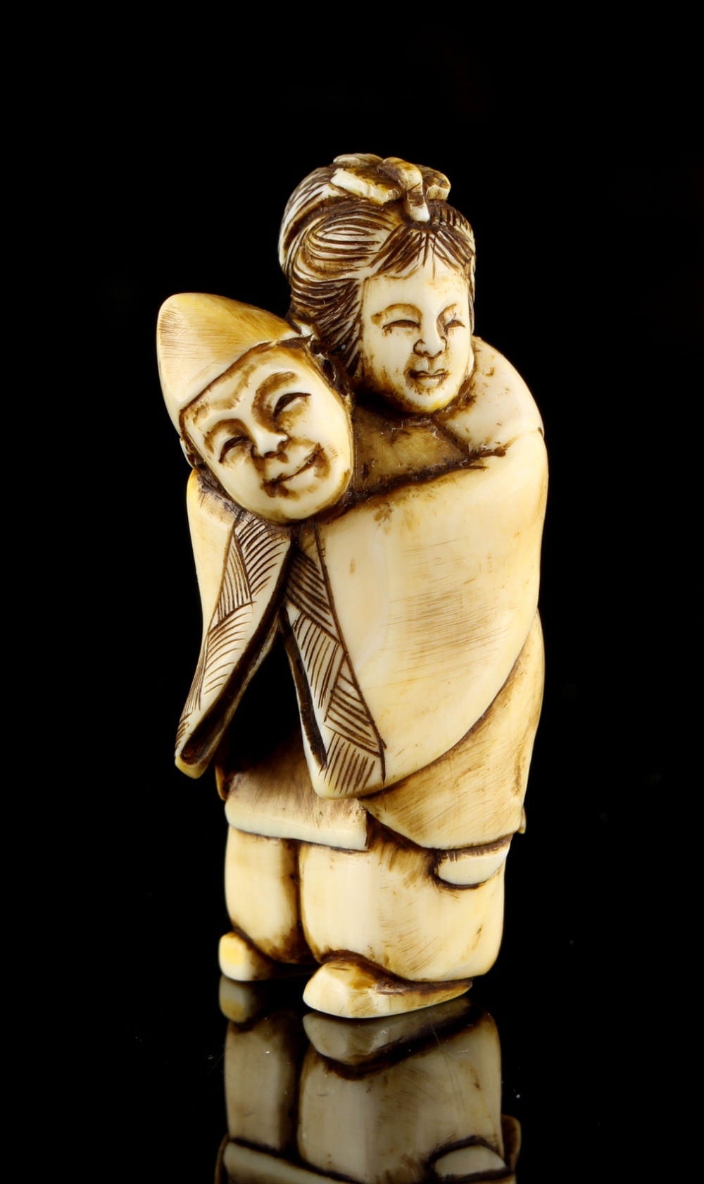 The Ronald Hart Collection of Japanese Netsukes - a carved ivory netsuke modelled as a standing - Image 2 of 5