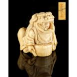 The Gill Collection of Japanese Netsukes - a carved ivory netsuke modelled as a seated boy